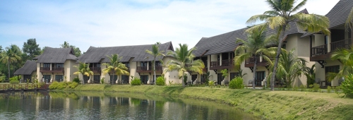 View of cottages and rooms by the lagoon at Zuri